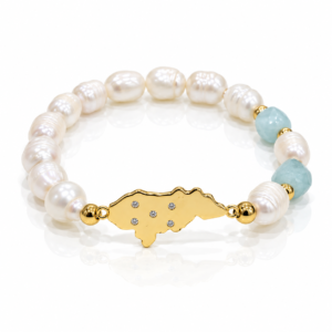 Pulsera blanca con mapa dorado y estrellas