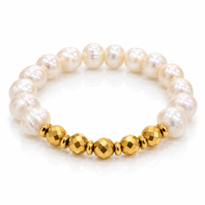 Pulsera blanca con cuentas doradas facetadas