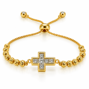 Pulsera dorada con cruz central brillante