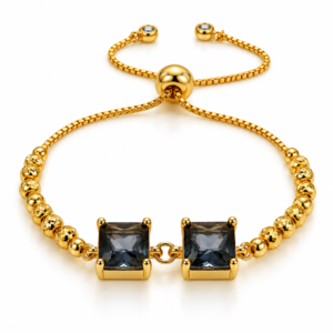 Pulsera dorada con dos cuadrados oscuros