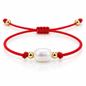 Pulsera roja con cuenta blanca ovalada