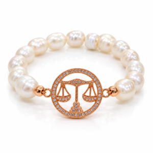 Pulsera blanca con balanza rosada