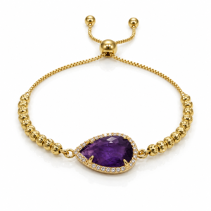Pulsera dorada con gota morada brillante
