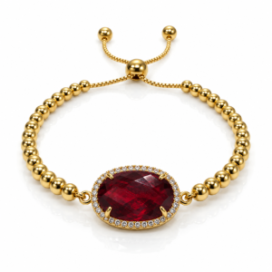 Pulsera dorada con óvalo rojo de borde brillante