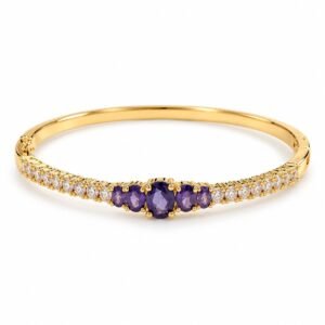 Pulsera rígida dorada con circonias moradas y transparentes