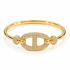 Pulsera rígida dorada con óvalo de circonias