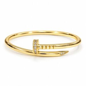 Pulsera rígida dorada diseño clavo con circonias