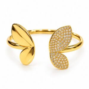 Pulsera rígida dorada con alas y circonias